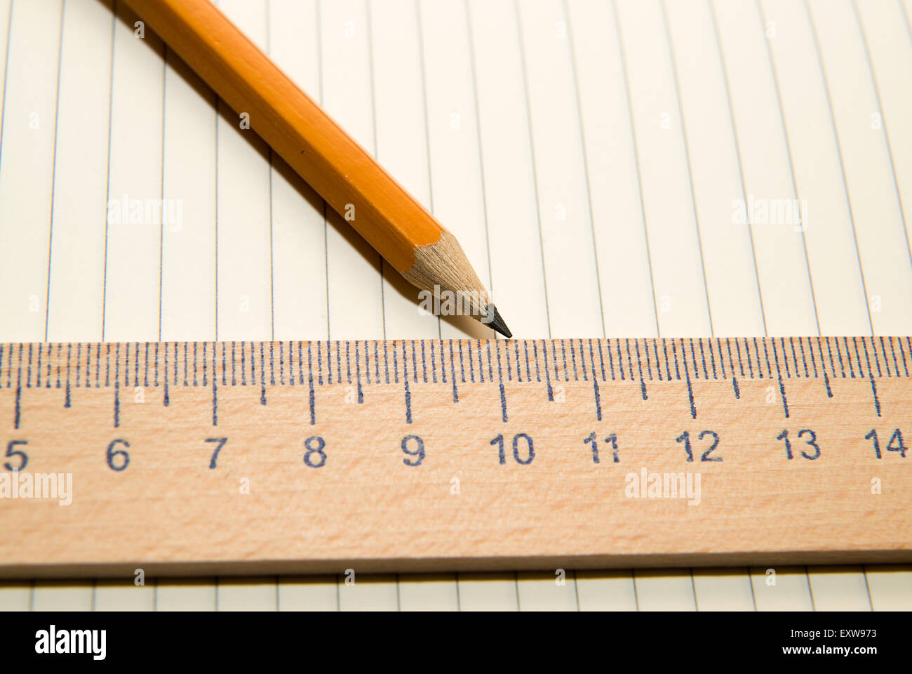 Notepad with a recording sheet, pencil and wooden ruler on the old ...