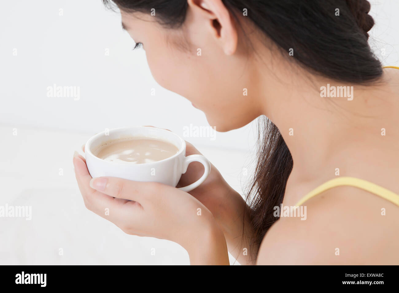 Young woman holding a cup, Stock Photo