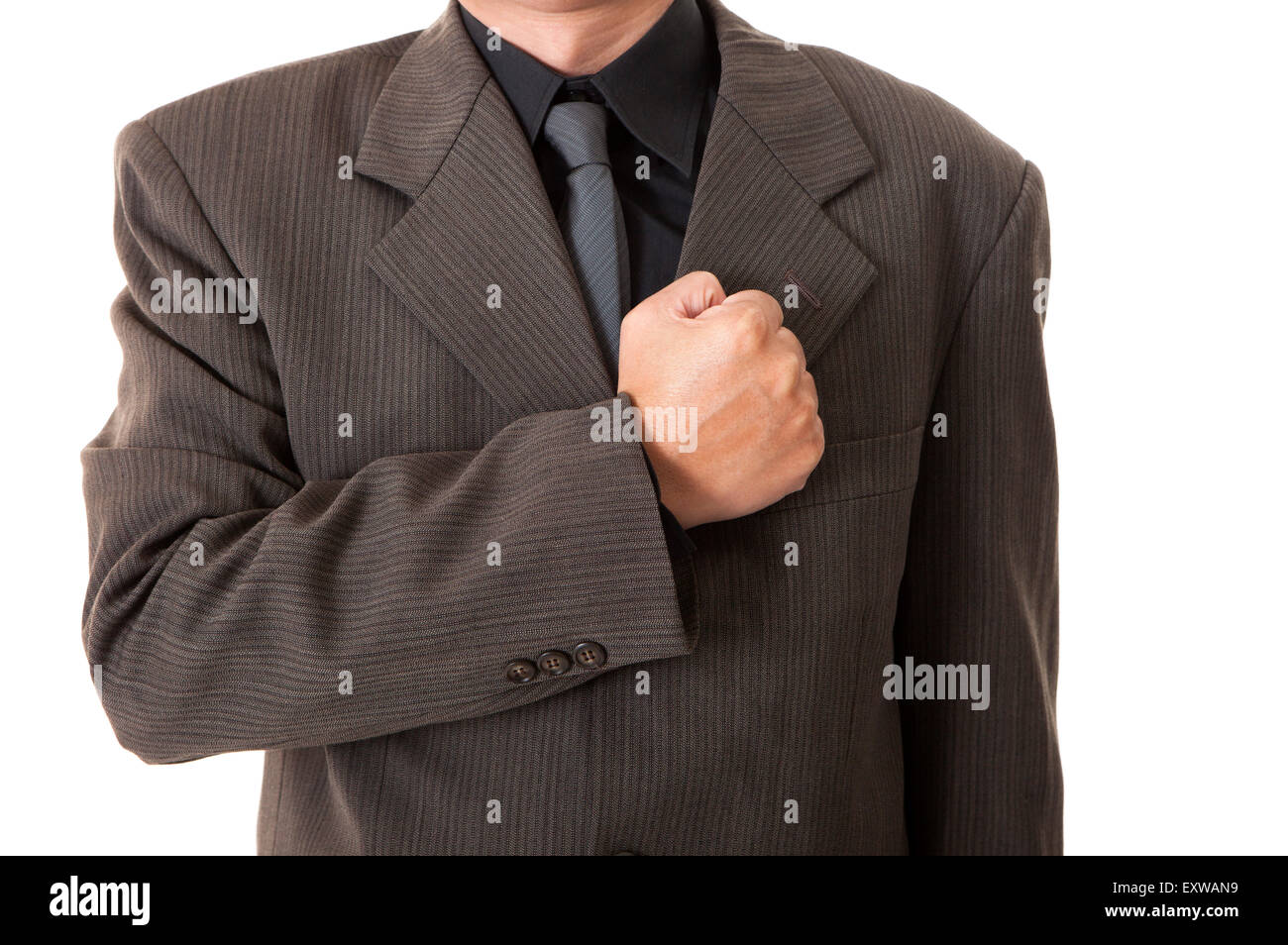 Man making oath with fist on chest Stock Photo Alamy