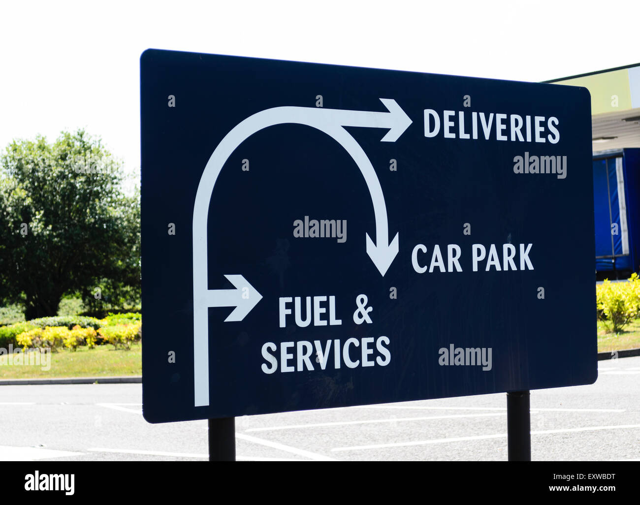 A sign for deliveries, car park and fuel services.UK Stock Photo