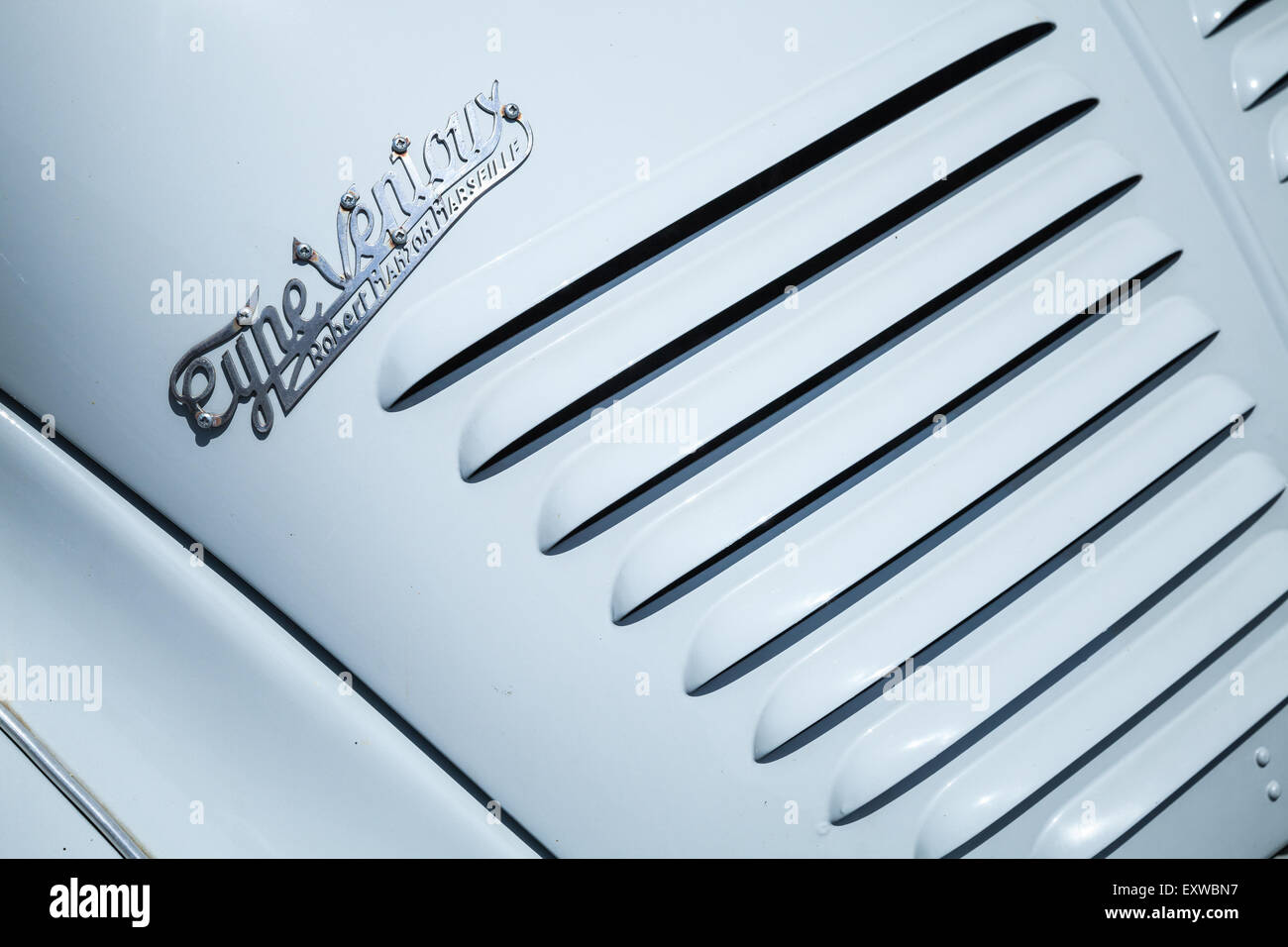 Ajaccio, France - July 6, 2015: rear radiator grille fragment of light blue Renault 4CV old-timer economy car with metal logo Stock Photo