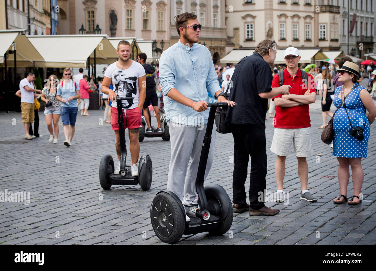Tourists on two-wheeled electric vehicle segway at Old Town Square, Prague, Czech Republic, on Thursday, July 16, 2015. (CTK Photo/Vit Simanek) Stock Photo