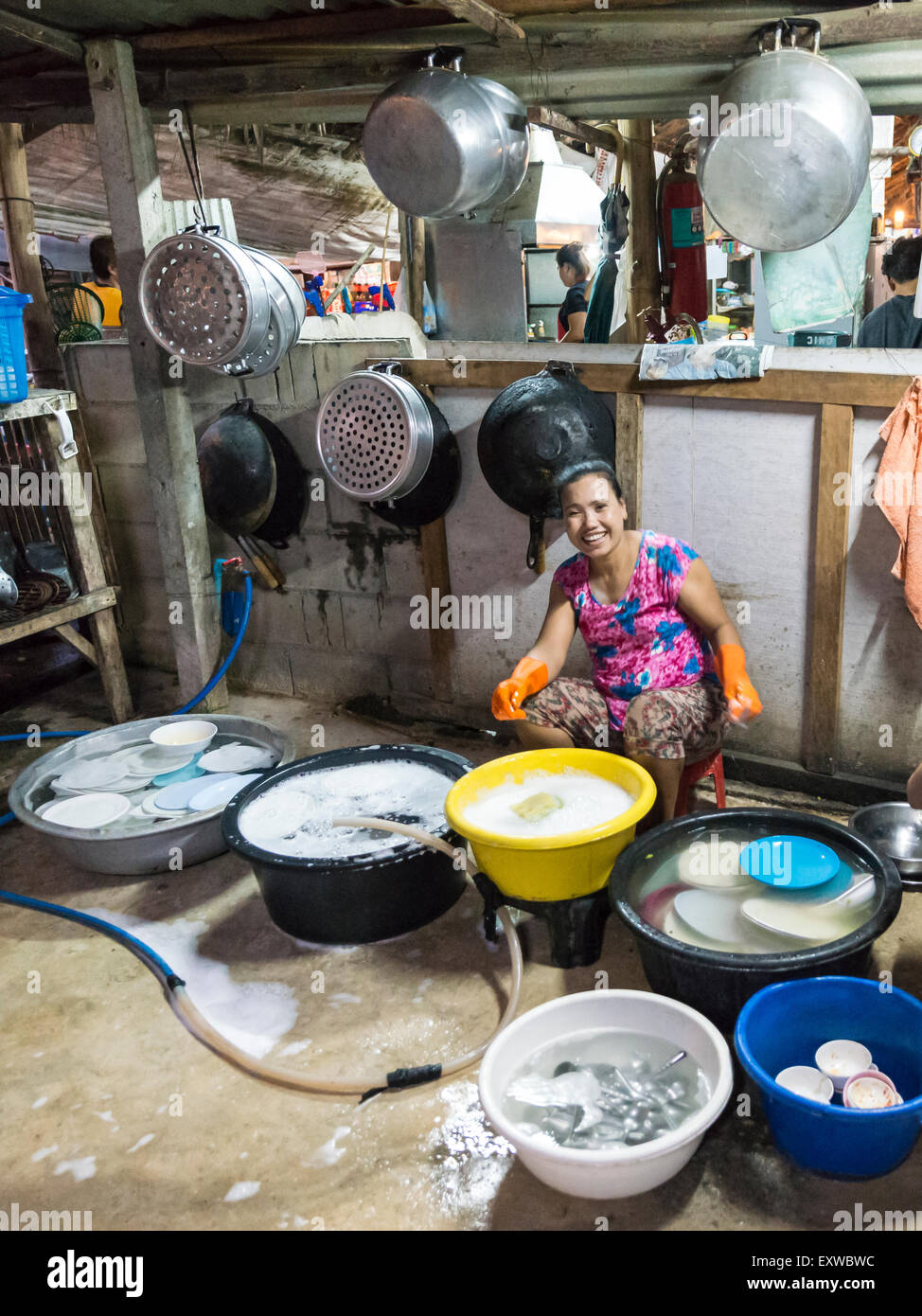 Thai woman washing dishes and pots, traditional restaurant, Kanchanaburi Province, Central Thailand, Thailand Stock Photo