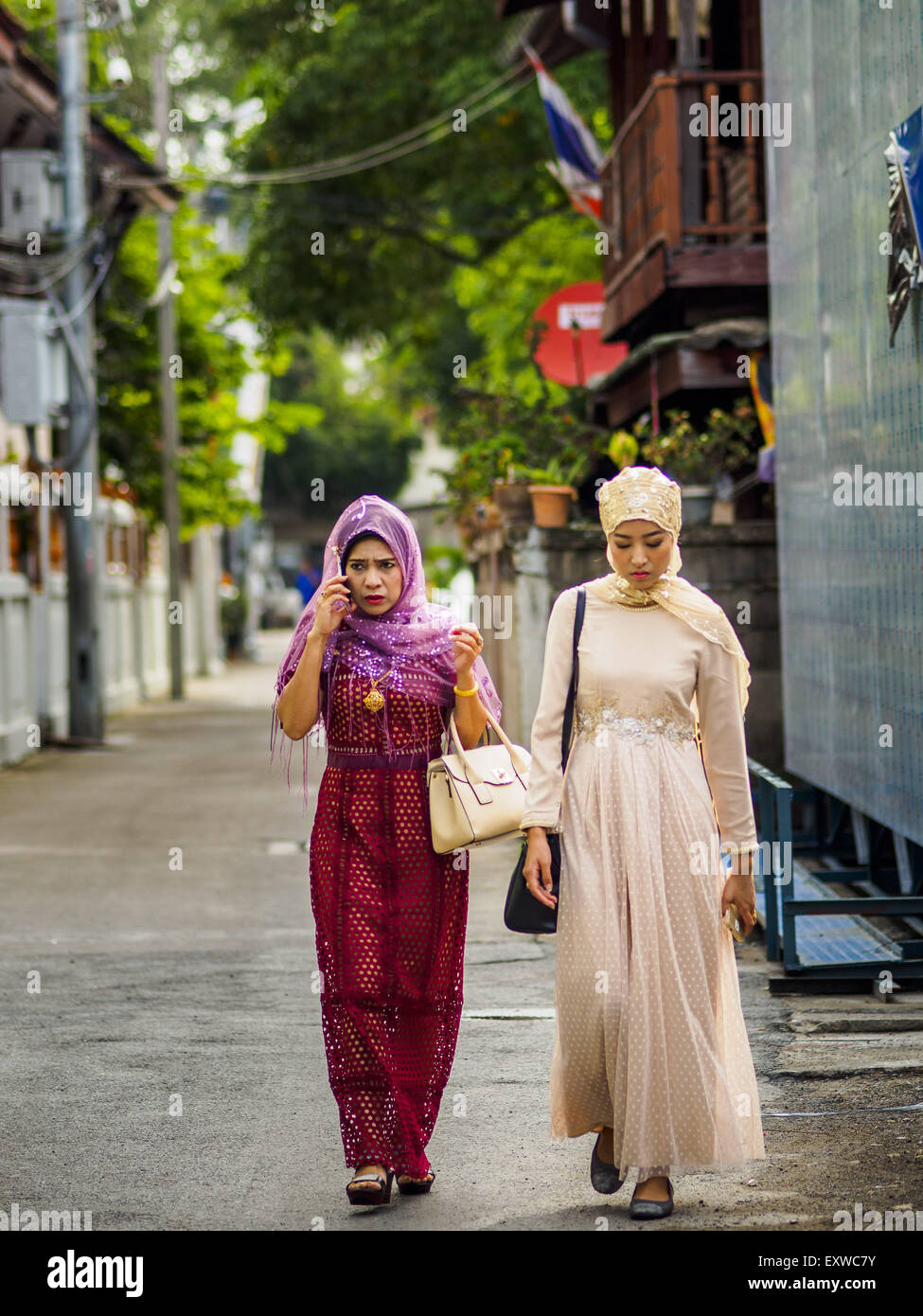 Bangkok, Thailand. 17th July, 2015. Women walk to Ton Son Mosque in Bangkok for Eid al-Fitr services. Eid al-Fitr is also called Feast of Breaking the Fast, the Sugar Feast, Bayram (Bajram), the Sweet Festival or Hari Raya Puasa and the Lesser Eid. It is an important Muslim religious holiday that marks the end of Ramadan, the Islamic holy month of fasting. Muslims are not allowed to fast on Eid. Credit:  ZUMA Press, Inc./Alamy Live News Stock Photo