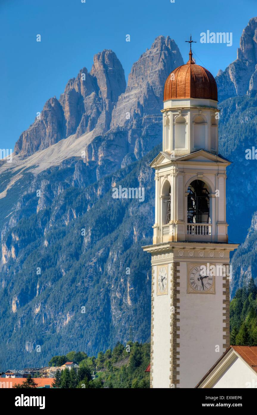 Church tower of Auronzo di Cadore with Tre Cime di Lavaredo, Dolomites, Italy Stock Photo