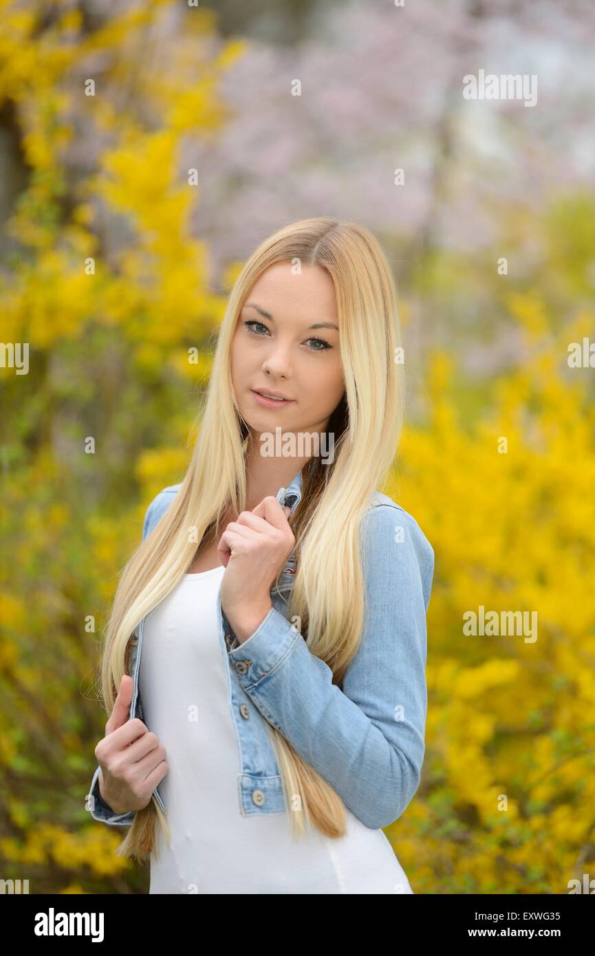Woman standing outdoors in park hi-res stock photography and images - Alamy