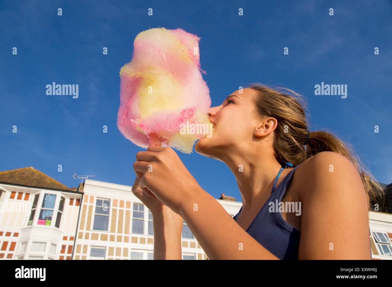 Teenage girl with candyfloss Stock Photo