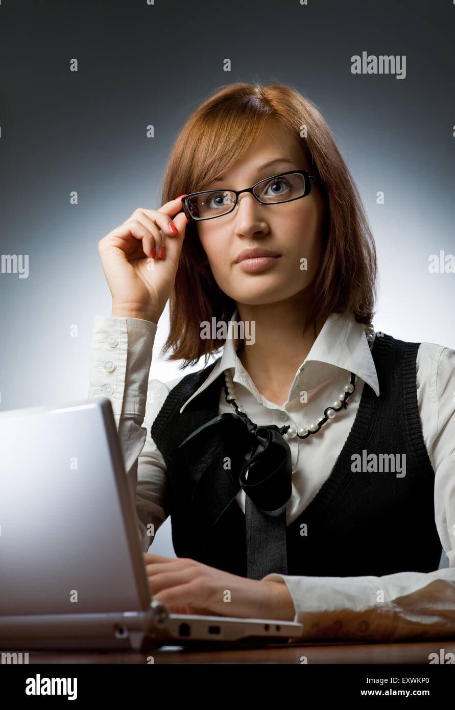 Beautiful young woman working on her laptop Stock Photo - Alamy