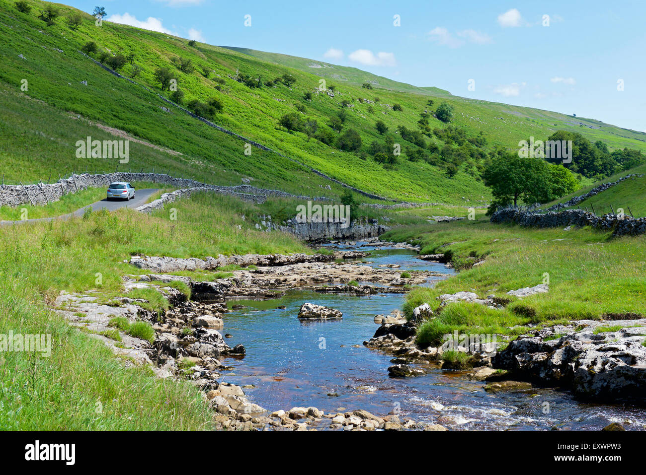 River Wharfe and car on B6160 road in Langstrothdale, Wharfedale, Yorkshire Dales National Park, North Yorkshire, England UK Stock Photo