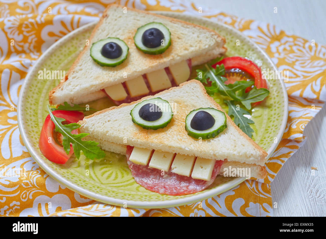 Funny sandwich for kids lunch on a table Stock Photo