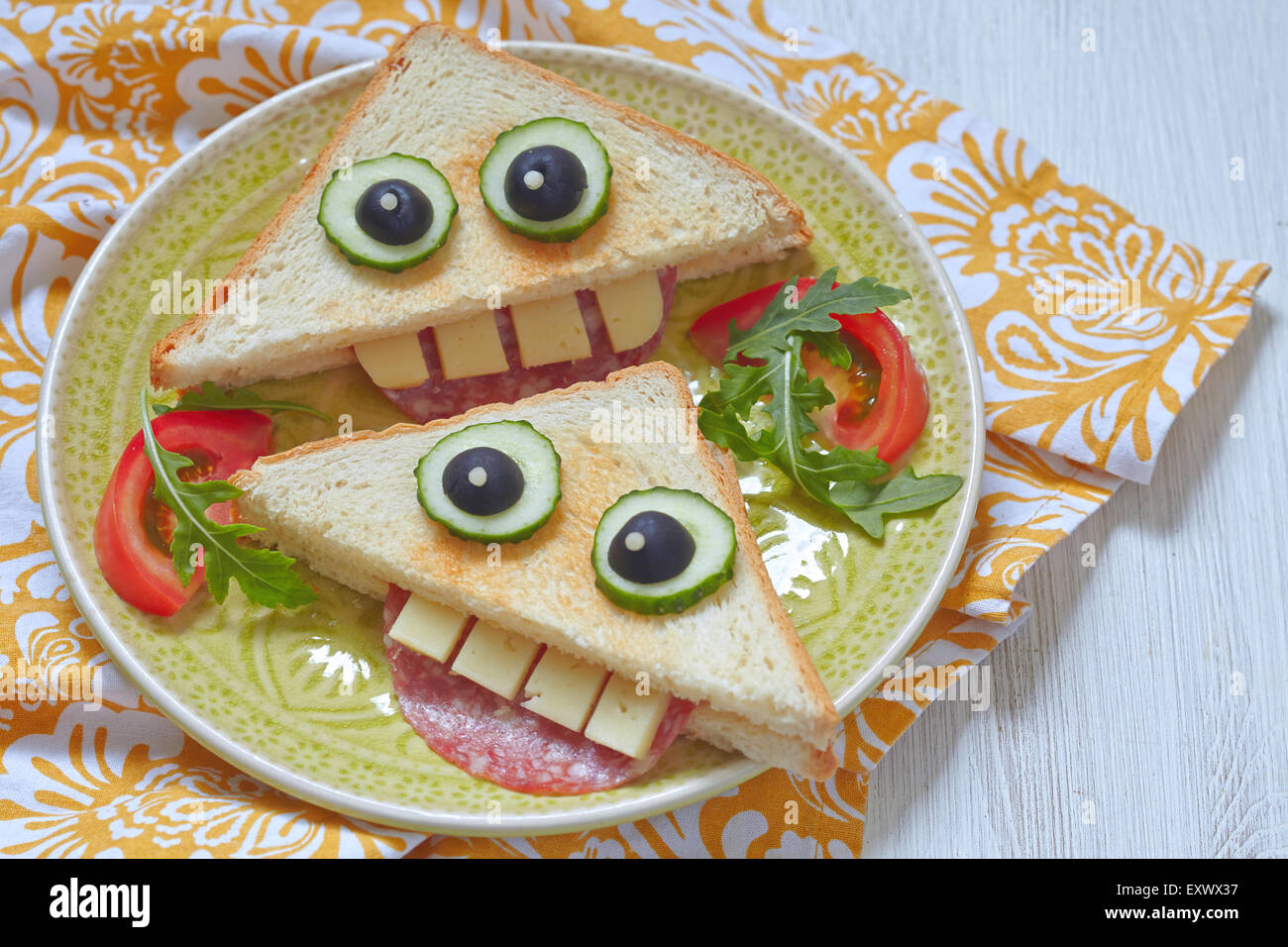 Funny sandwich for kids lunch on a table Stock Photo