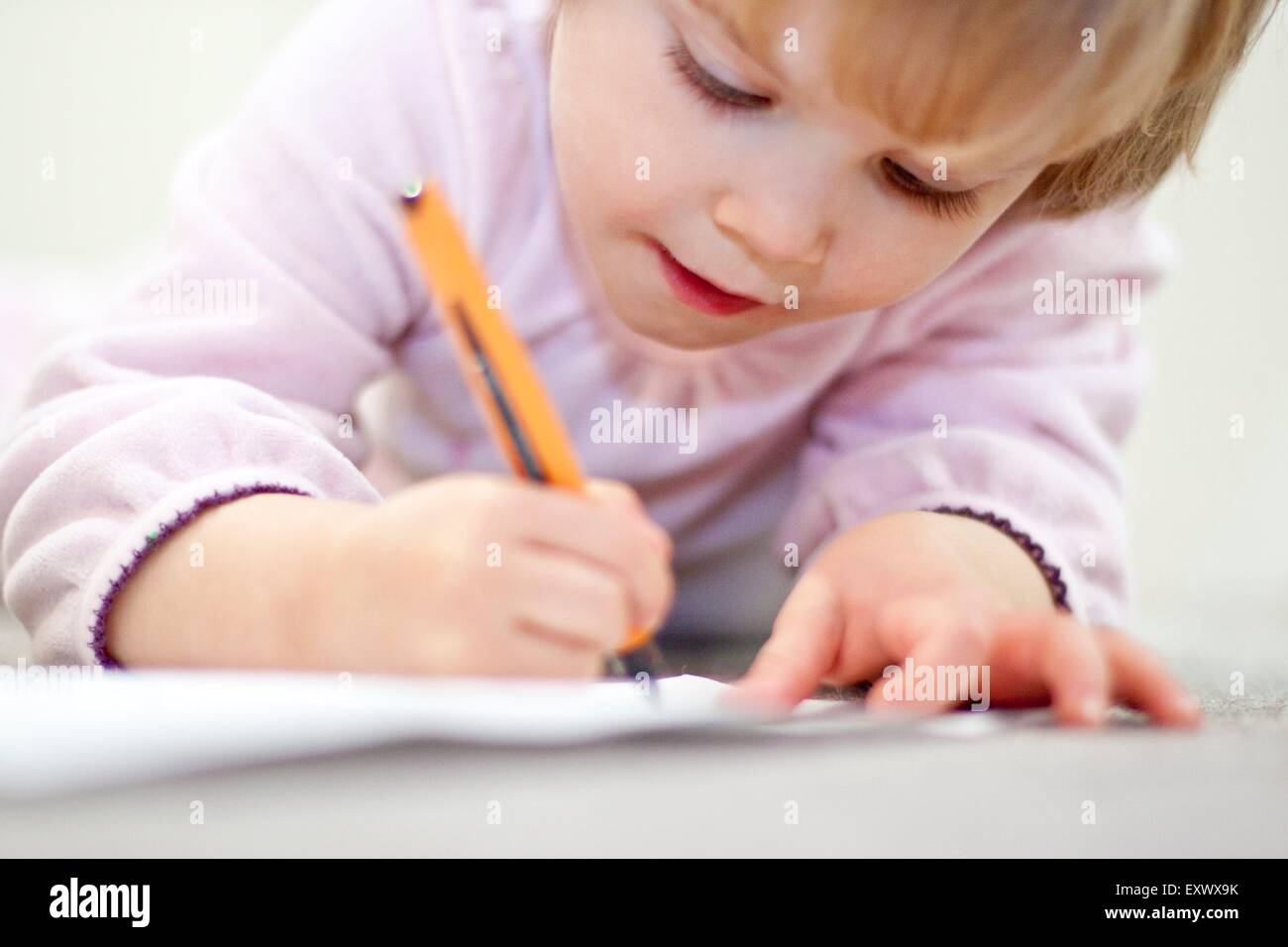 girl writing and painting Stock Photo