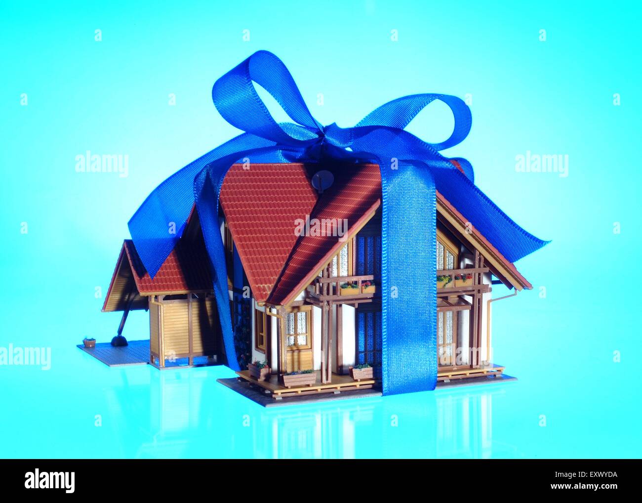 Model house as present with bow Stock Photo