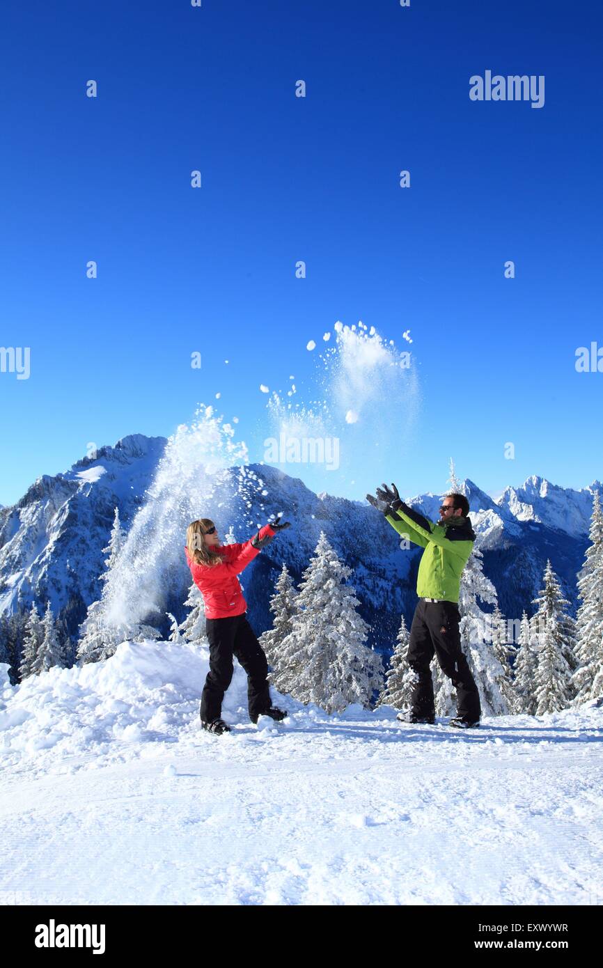 Two persons in snow, Tegelberg, Ammergau Alps, Allgaeu, Bavaria, Germany, Europe Stock Photo