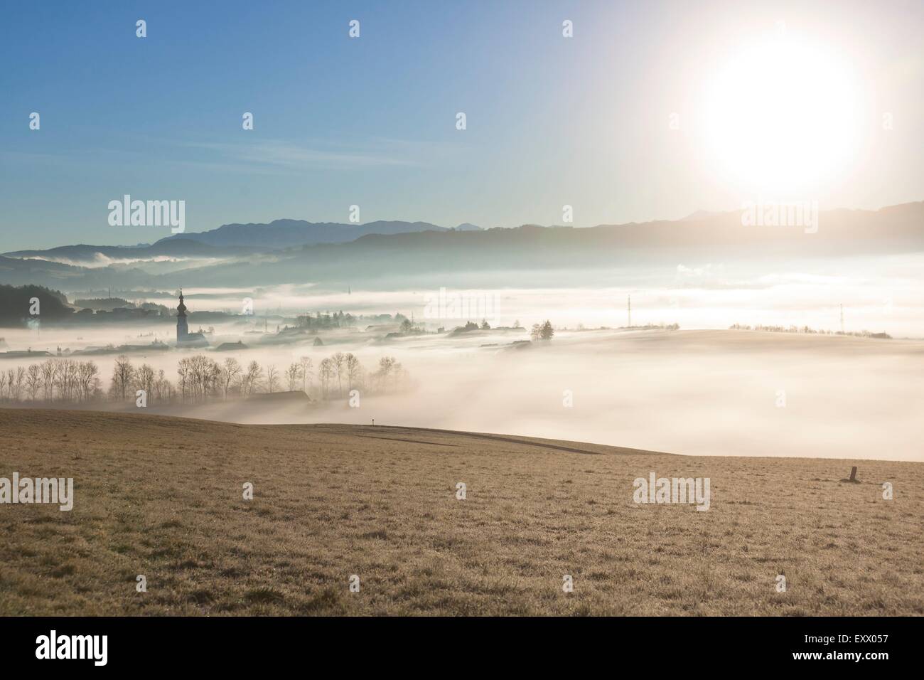 Ground fog over village Köstendorf in Flachgau in winter, Austria Stock Photo