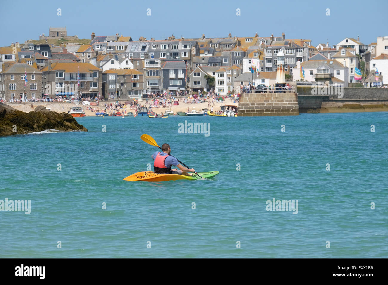 St Ives, Cornwall, UK Man in Kayak paddling towards St Ives Harbour