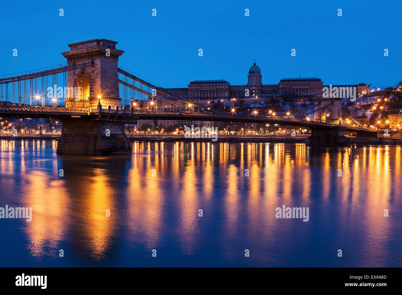 Illuminated Chain Bridge and Buda skyline Stock Photo