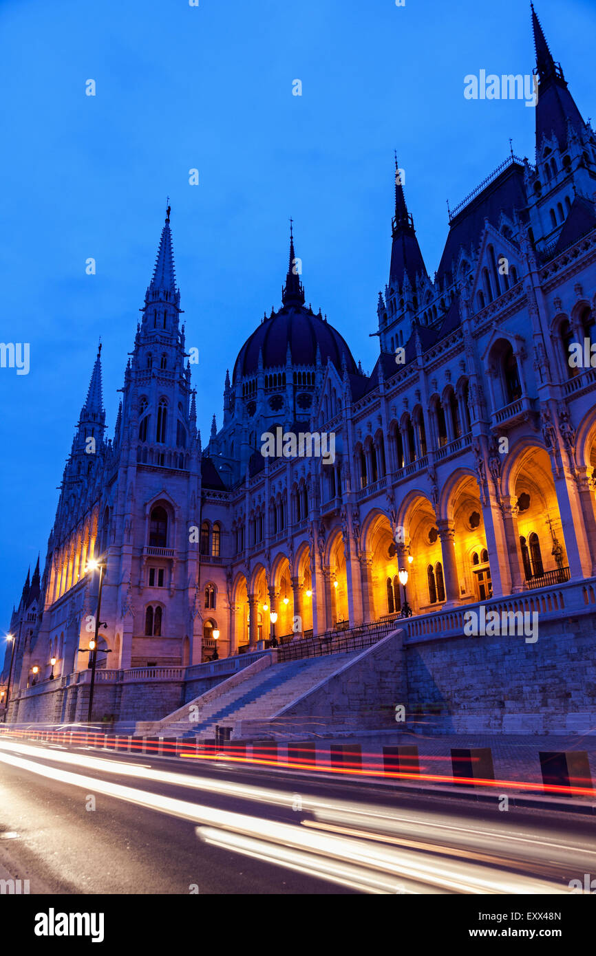 Illuminated Hungarian Parliament and light trails Stock Photo