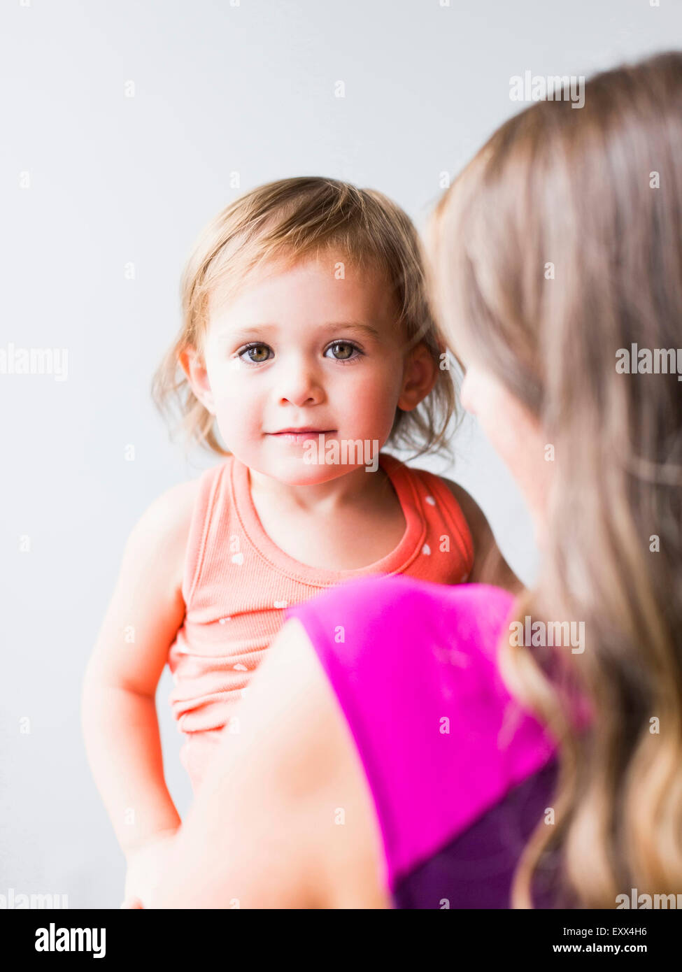 Little girl (2-3) with mother Stock Photo