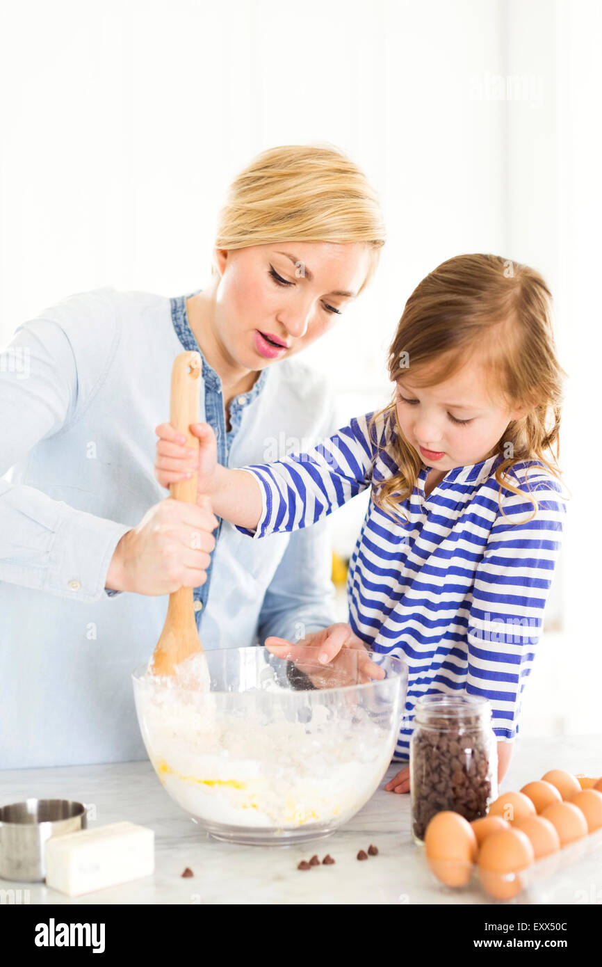 Mother and daughter (4-5) baking Stock Photo