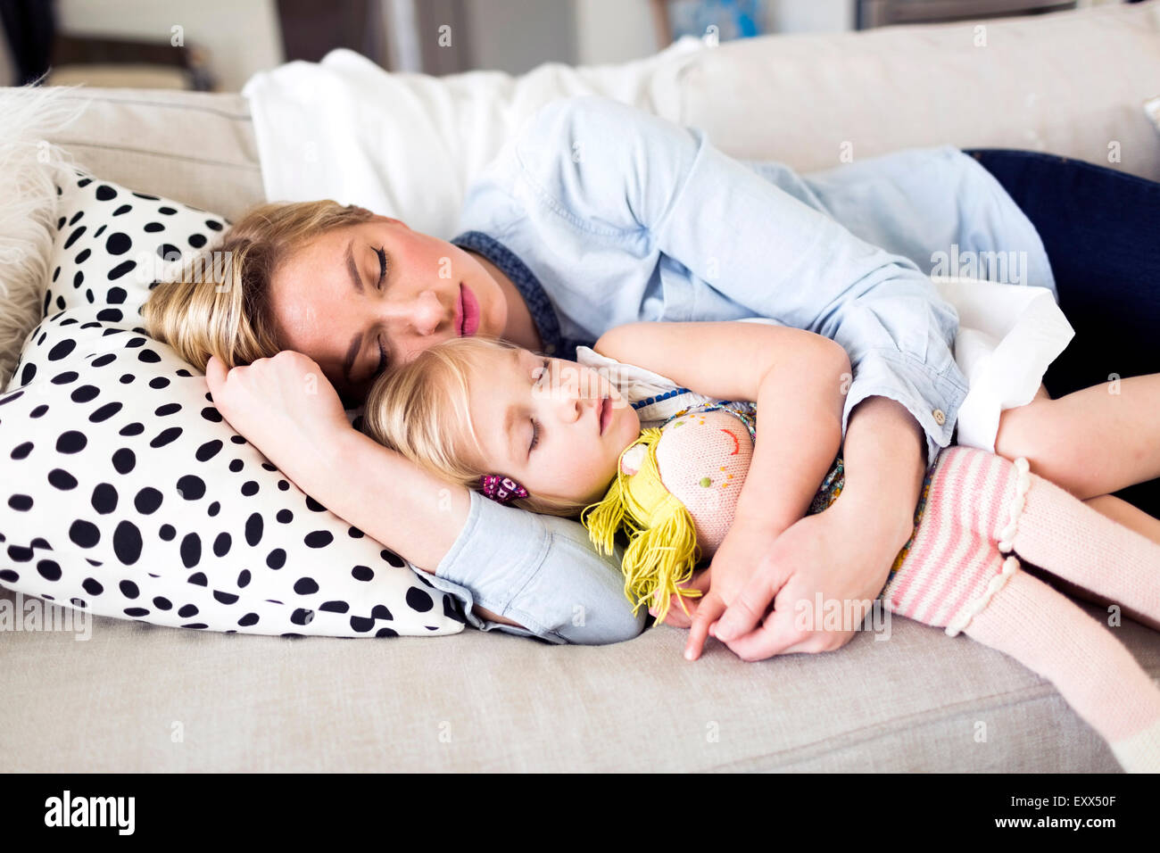 Mother and daughter (23) sleeping on sofa Stock Photo Alamy