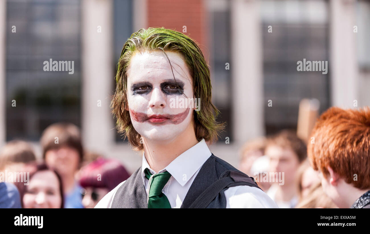 London, UK. 17 July 2015. Fans, including this man dressed as The Joker from Batman, gather outside Olympia in Kensington for the opening day of London Film & Comic Con, a convention for lovers of film, television and comics. Many attendees will have the chance to meet their on screen heroes during the three day event through live appearances from Hollywood movie stars. Credit:  Stephen Chung/Alamy Live News Stock Photo