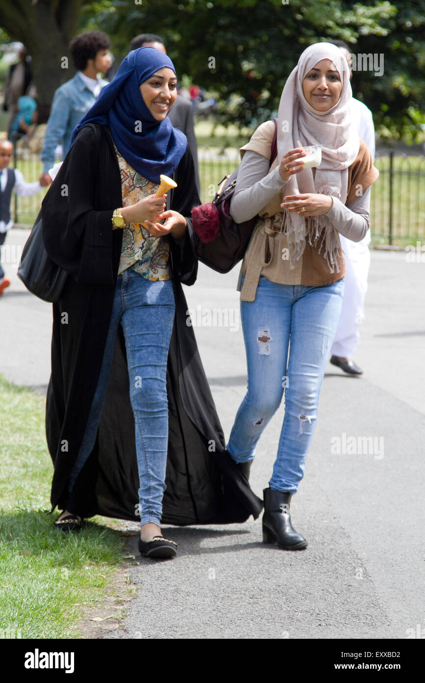 London, UK. 17th July, 2015. Two young Muslim girls enjoy eating ice cream on the  the last day of the holy month of Ramadan fasting Credit:  amer ghazzal/Alamy Live News Stock Photo
