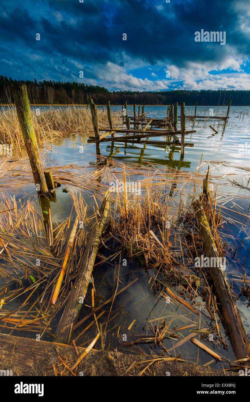 Small pier on lake, beautiful long exposure photo. Mazury lake district. Stock Photo