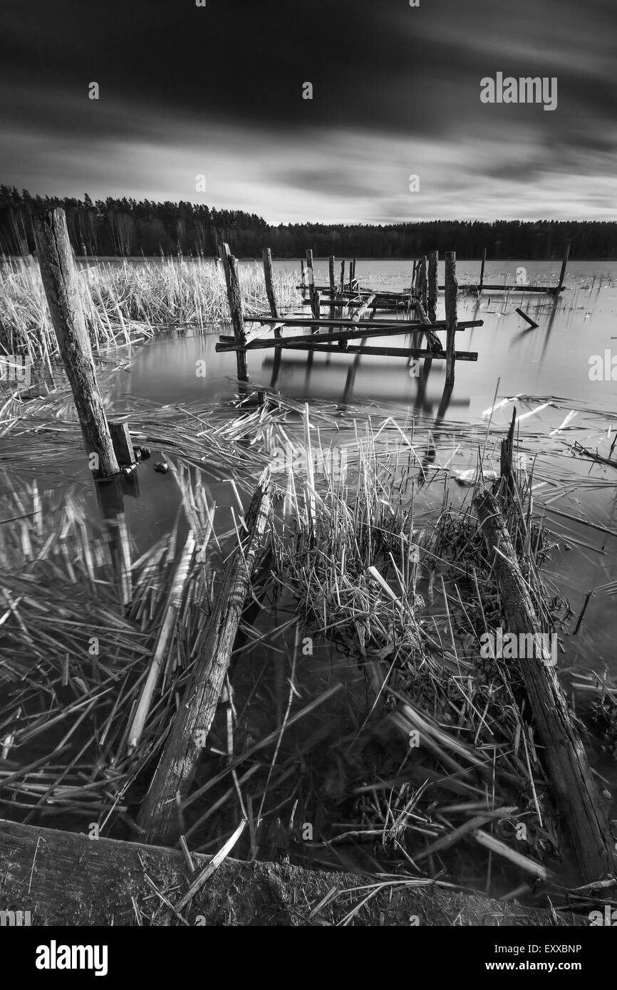 Small pier on lake, beautiful long exposure photo. Mazury lake district. Stock Photo