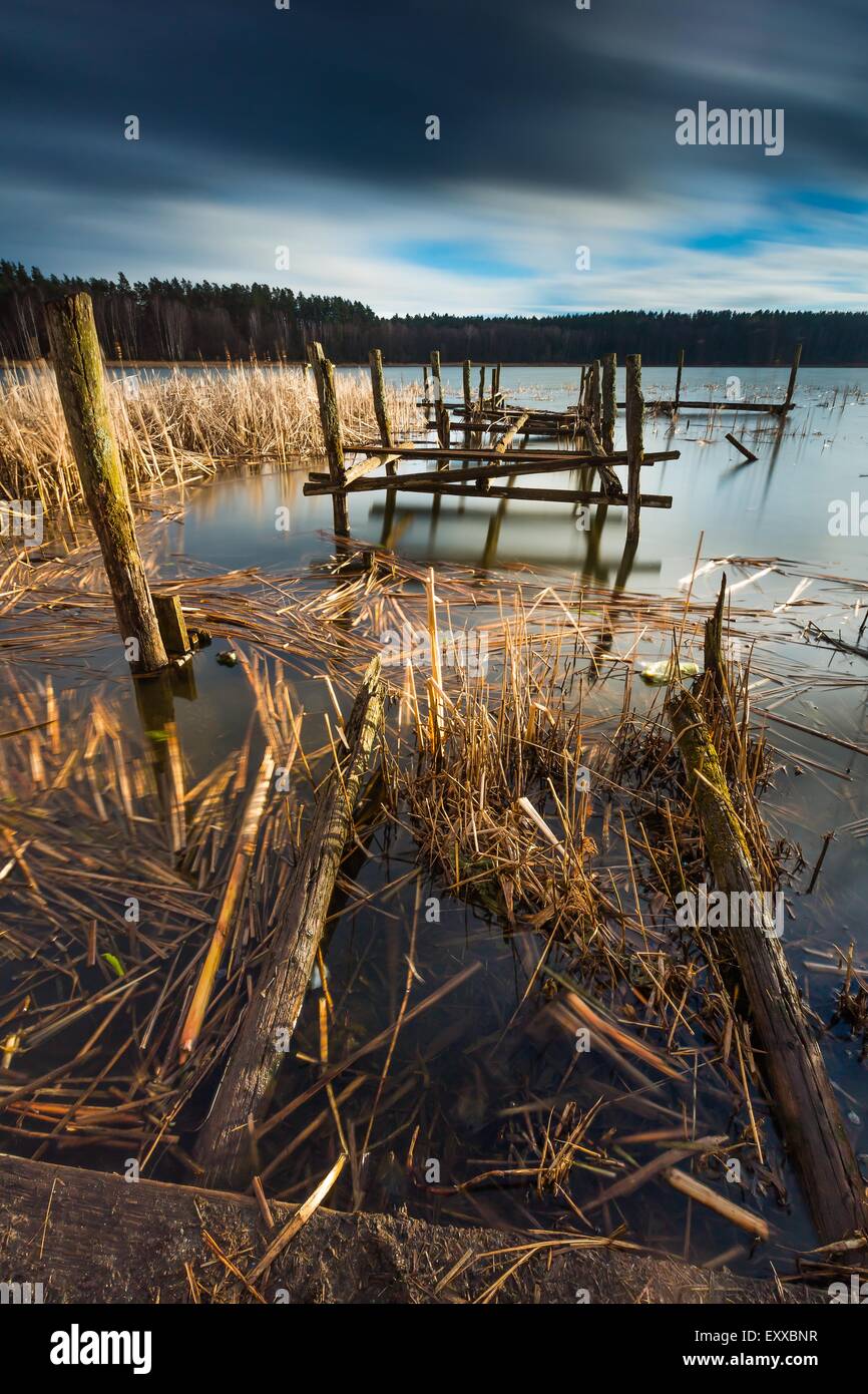 Small pier on lake, beautiful long exposure photo. Mazury lake district. Stock Photo