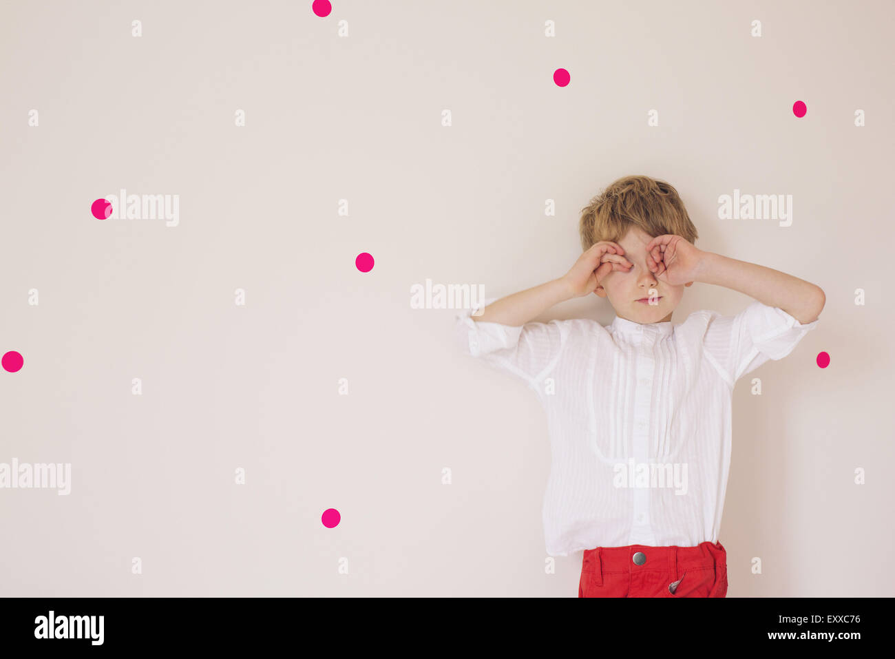 Little boy covering eyes with his hands, portrait Stock Photo - Alamy