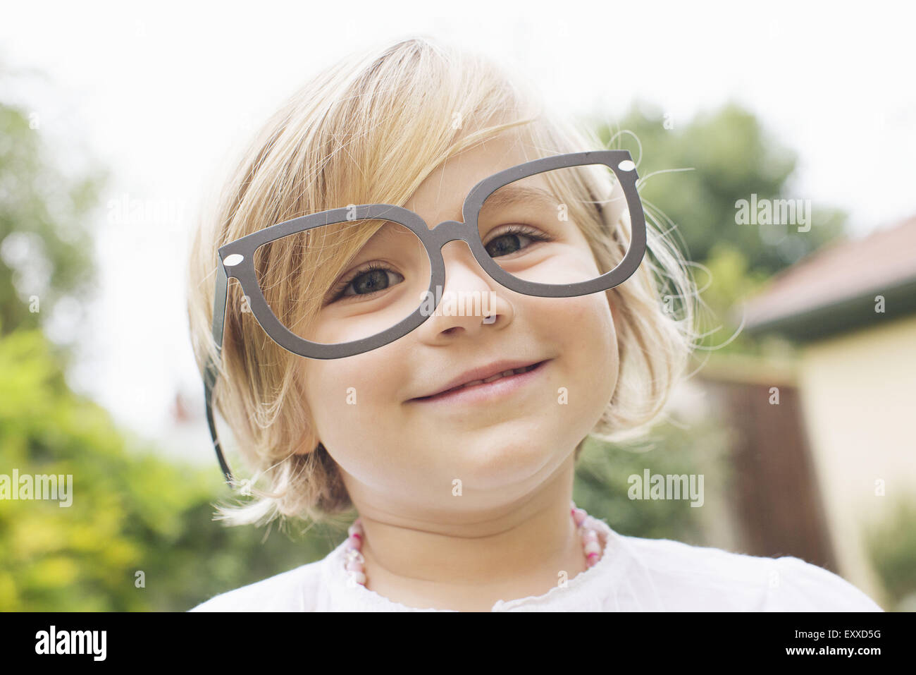 Little girl wearing costume glasses Stock Photo Alamy