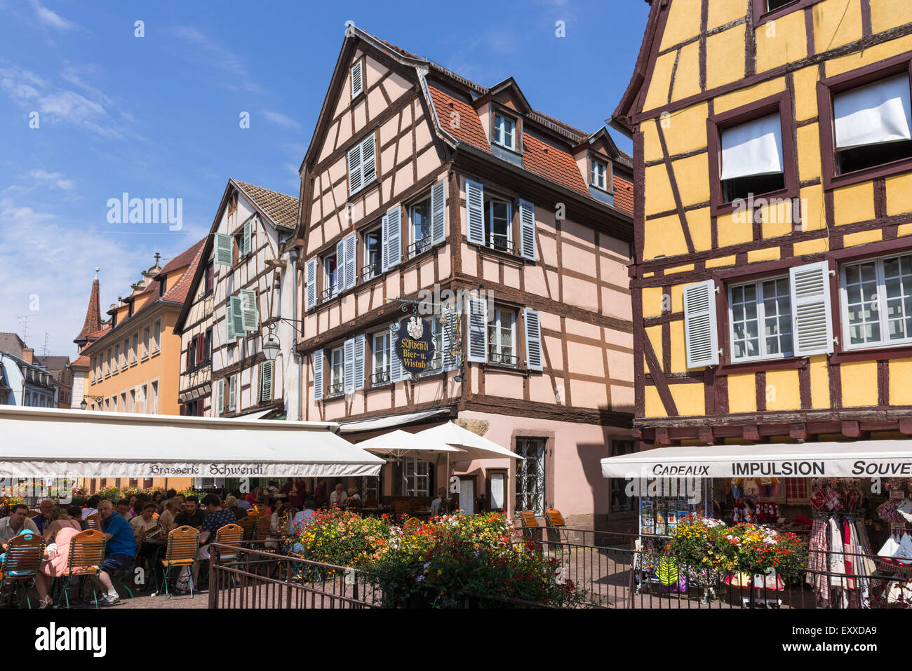 Cafe bar and medieval buildings in the Old Town in Colmar, Alsace, France, Europe Stock Photo