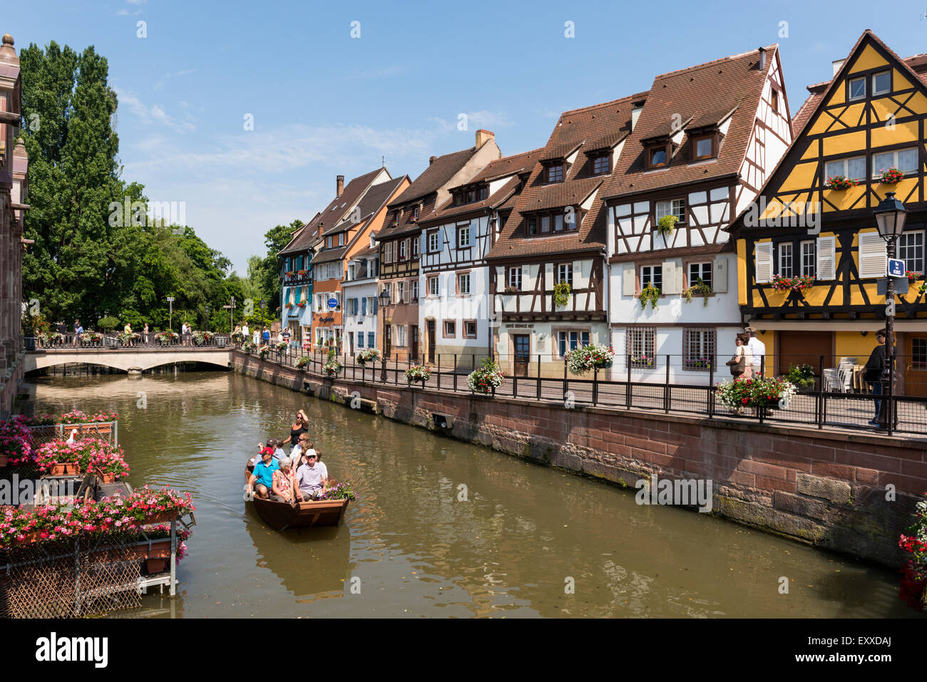 Tourists boating in La Petite Venise  or Little Venice district, Old Town, Colmar, Alsace, France Stock Photo