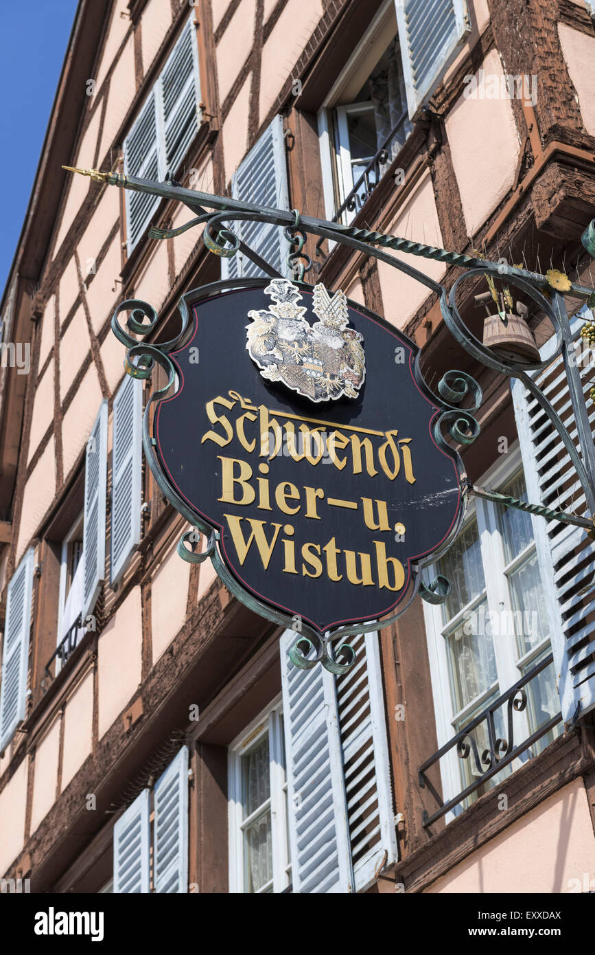 Pub sign in German for the well-known Schwendi Bier Wistub in Old Town in Colmar, Alsace, France, Europe on the German border Stock Photo