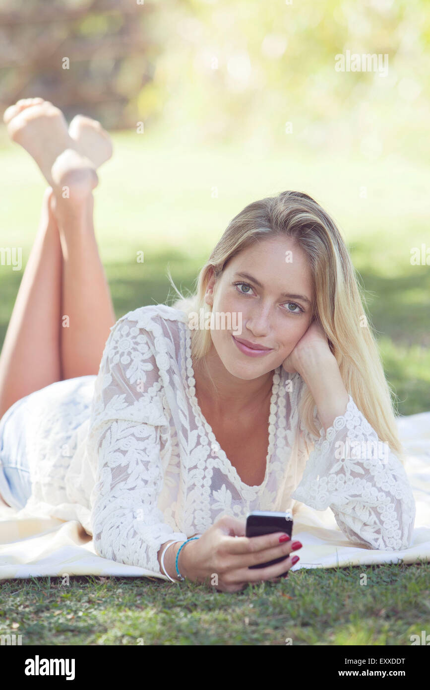 Young woman relaxing in park hi-res stock photography and images - Alamy