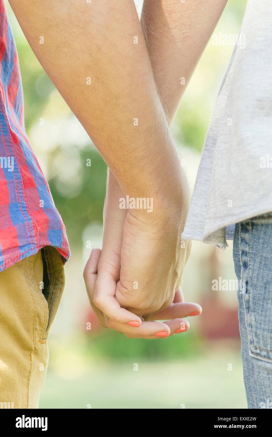 Holding hands couple hi-res stock photography and images - Alamy