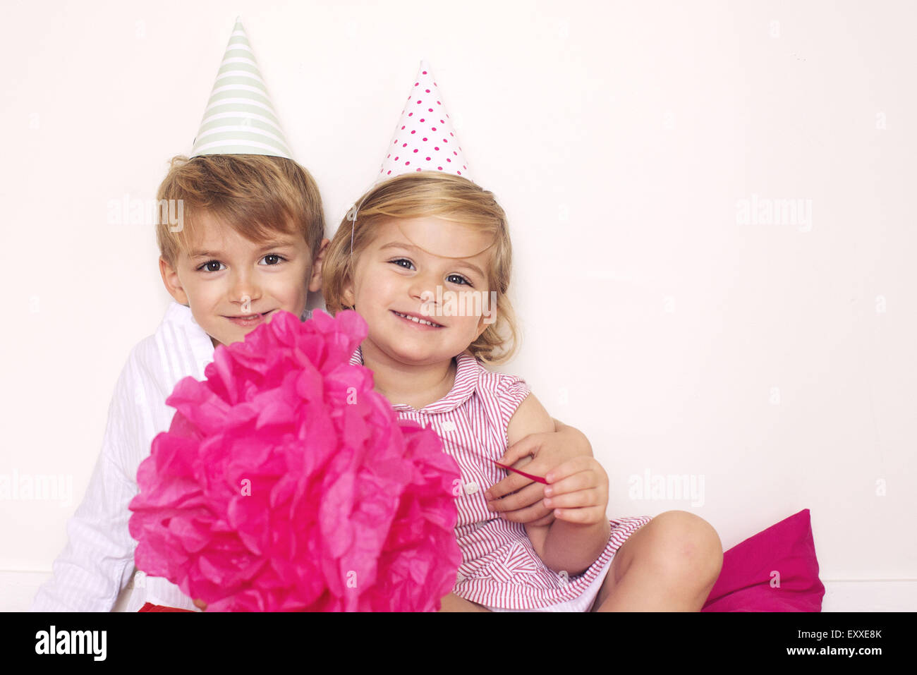 Brother and sister at birthday party, portrait Stock Photo