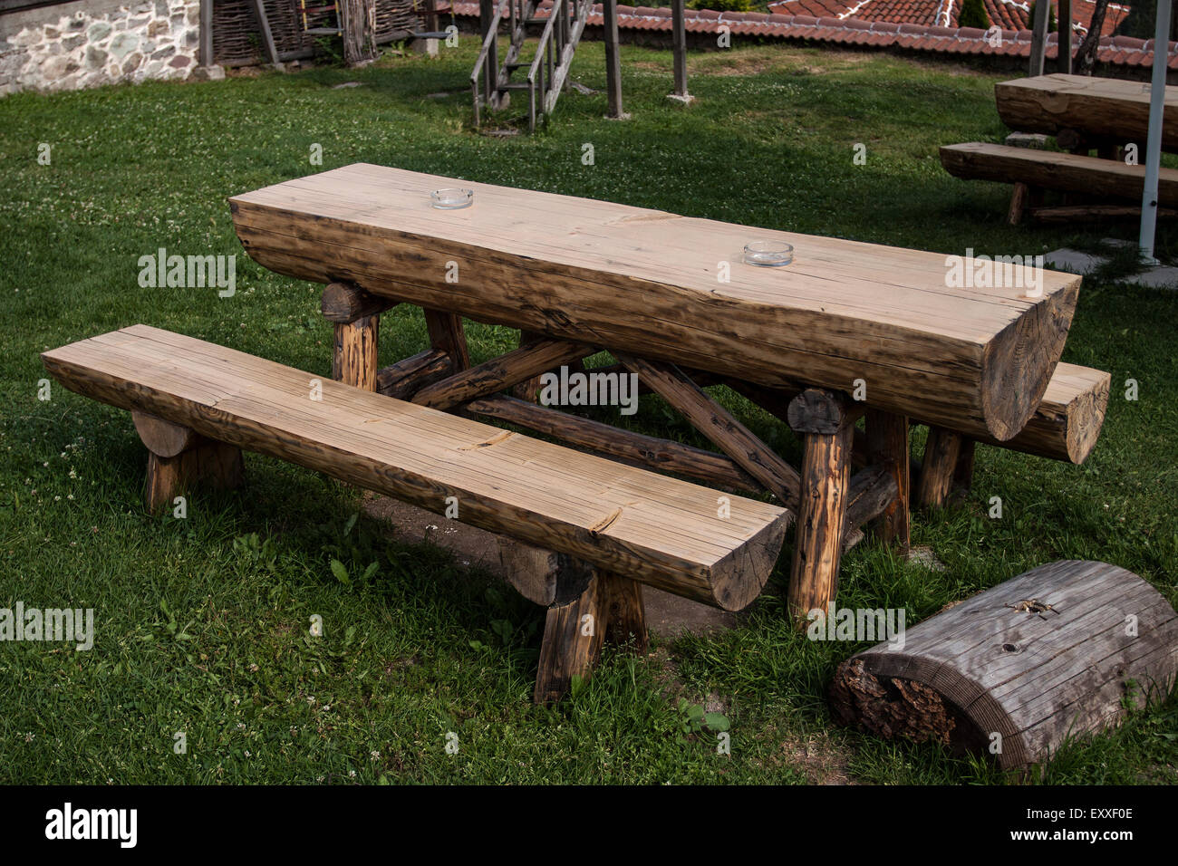 Garden wooden table and bench isolated in the green meadows Stock Photo -  Alamy