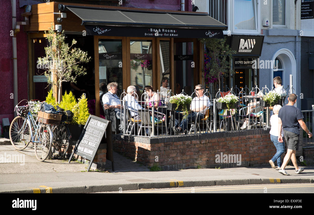 People sitting outside Cafe Valance, Oystermouth, Mumbles, Gower peninsula, near Swansea, South Wales, UK Stock Photo