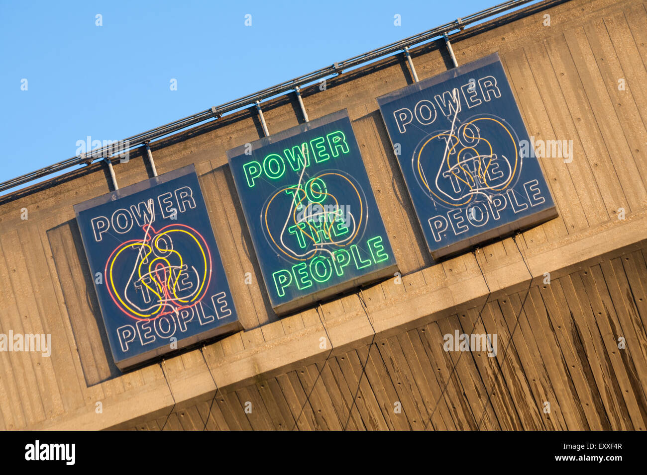 Power to the People neon lit signs at Purcell Room, Queen Elizabeth Hall, South Bank, London in May Stock Photo
