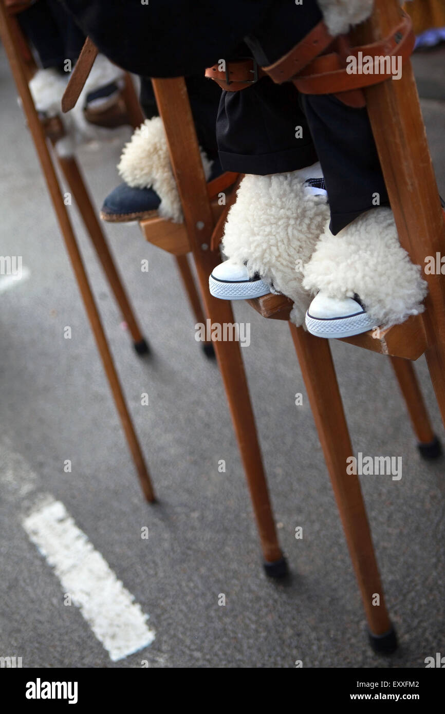 Shepherds on stilts in a village festival Stock Photo Alamy