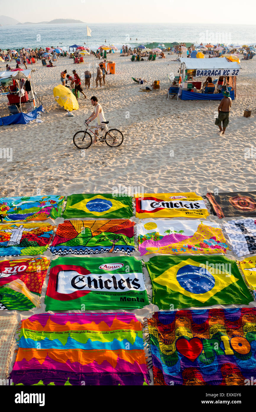 RIO DE JANEIRO, BRAZIL - MARCH 15, 2015: Beach blanket sarongs known locally as canga spread out in colorful display in Ipanema. Stock Photo