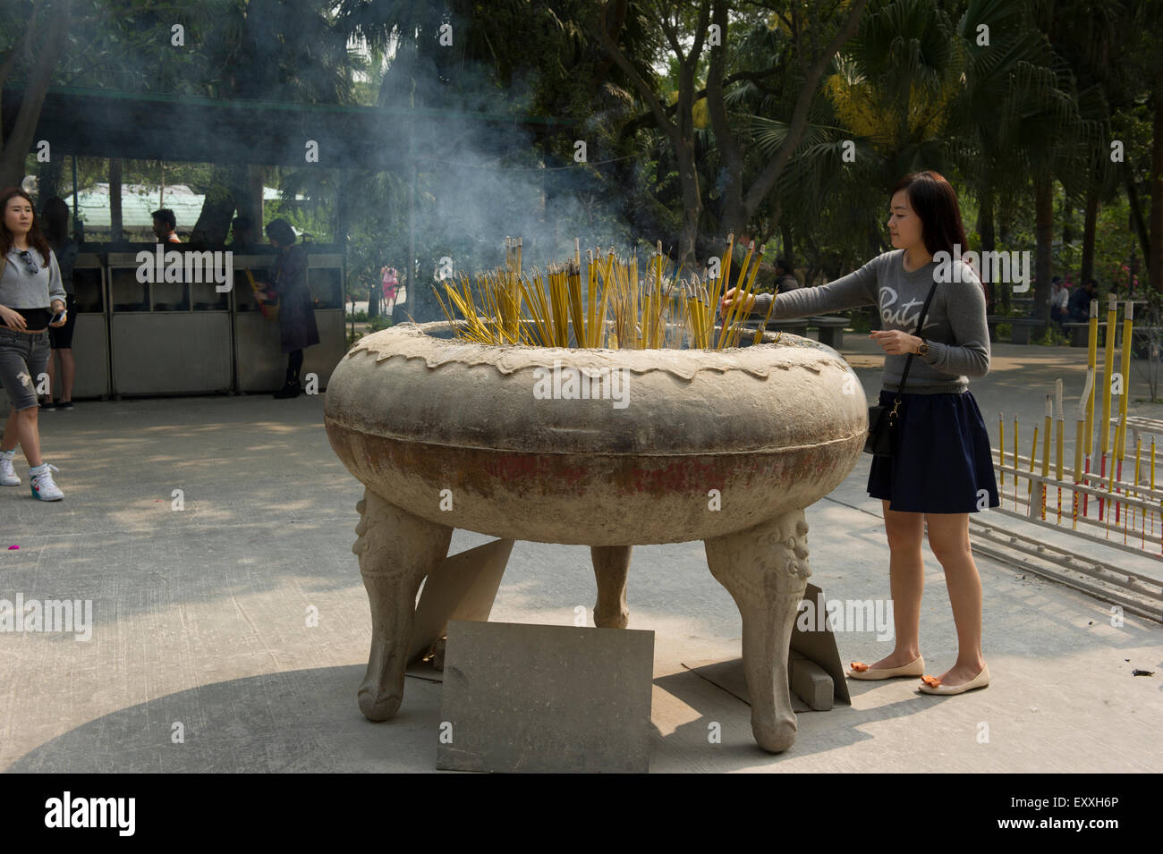 Buddhist ritual of Incense offerings placed in a censer at the entrance of Po LIn Monastery