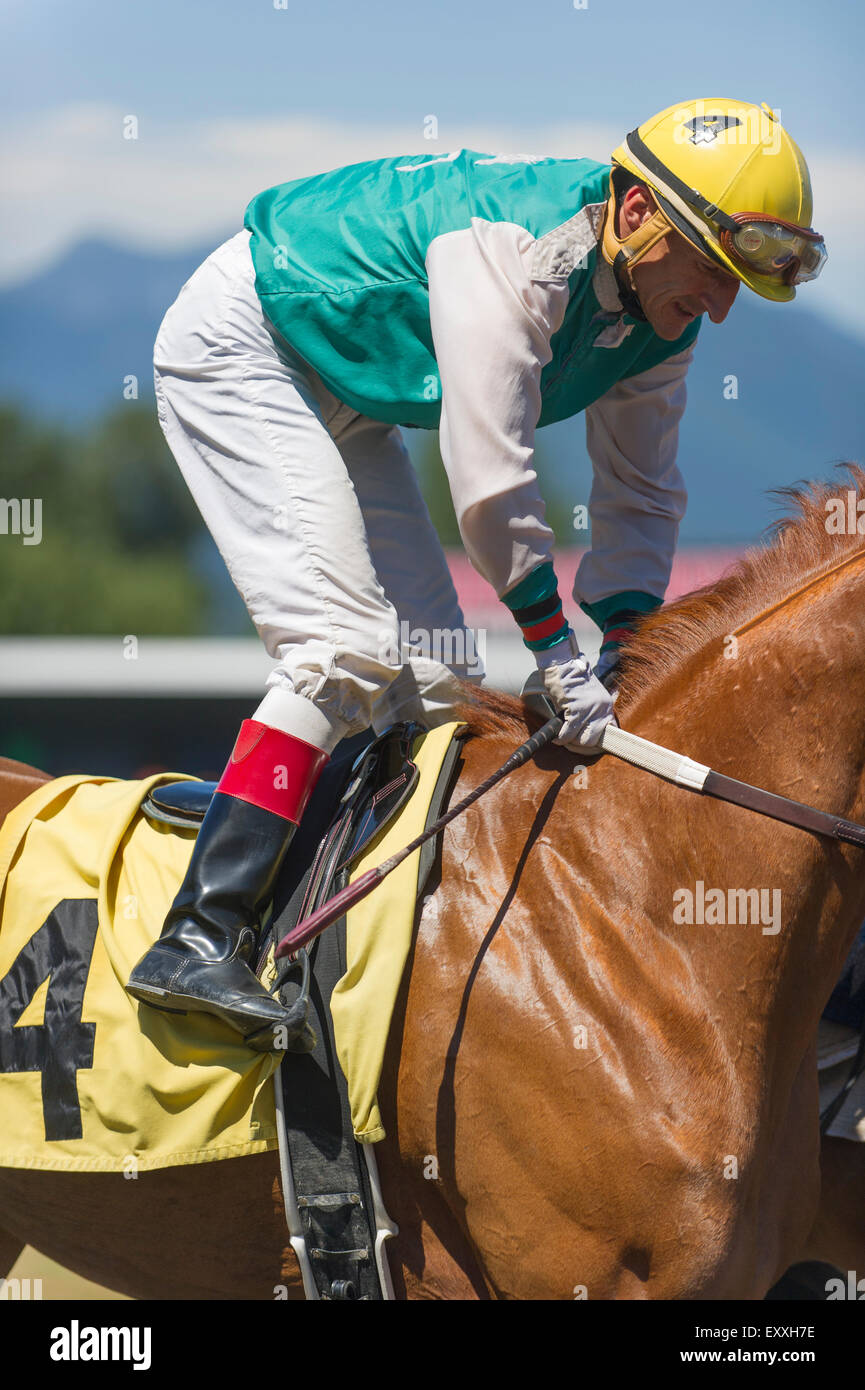 Jockey on race horse at Vancouver Hastings Exhibition Park race track. Stock Photo