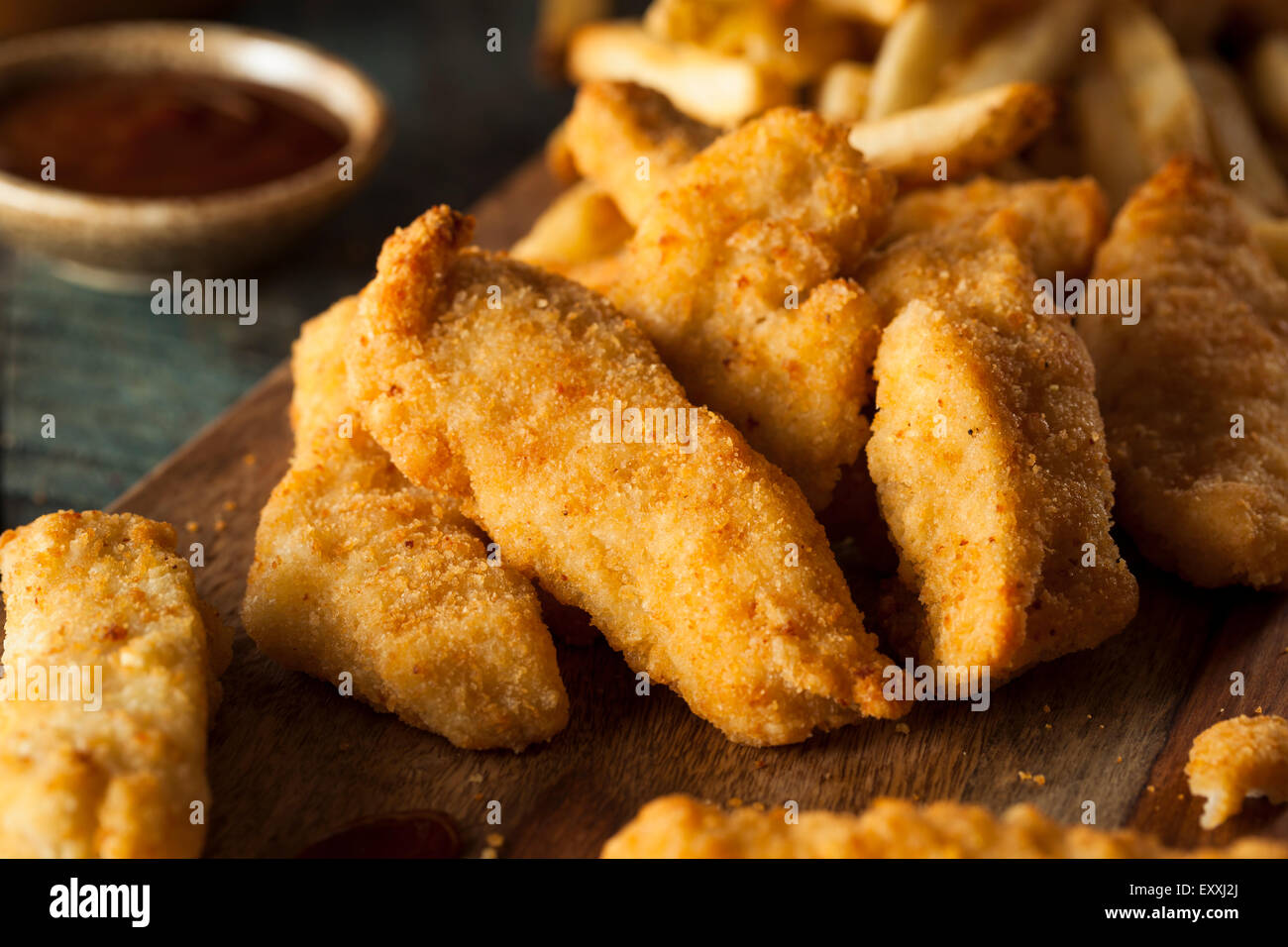 Homemade Breaded Chicken Tenders with Fries and BBQ Sauce Stock Photo Alamy