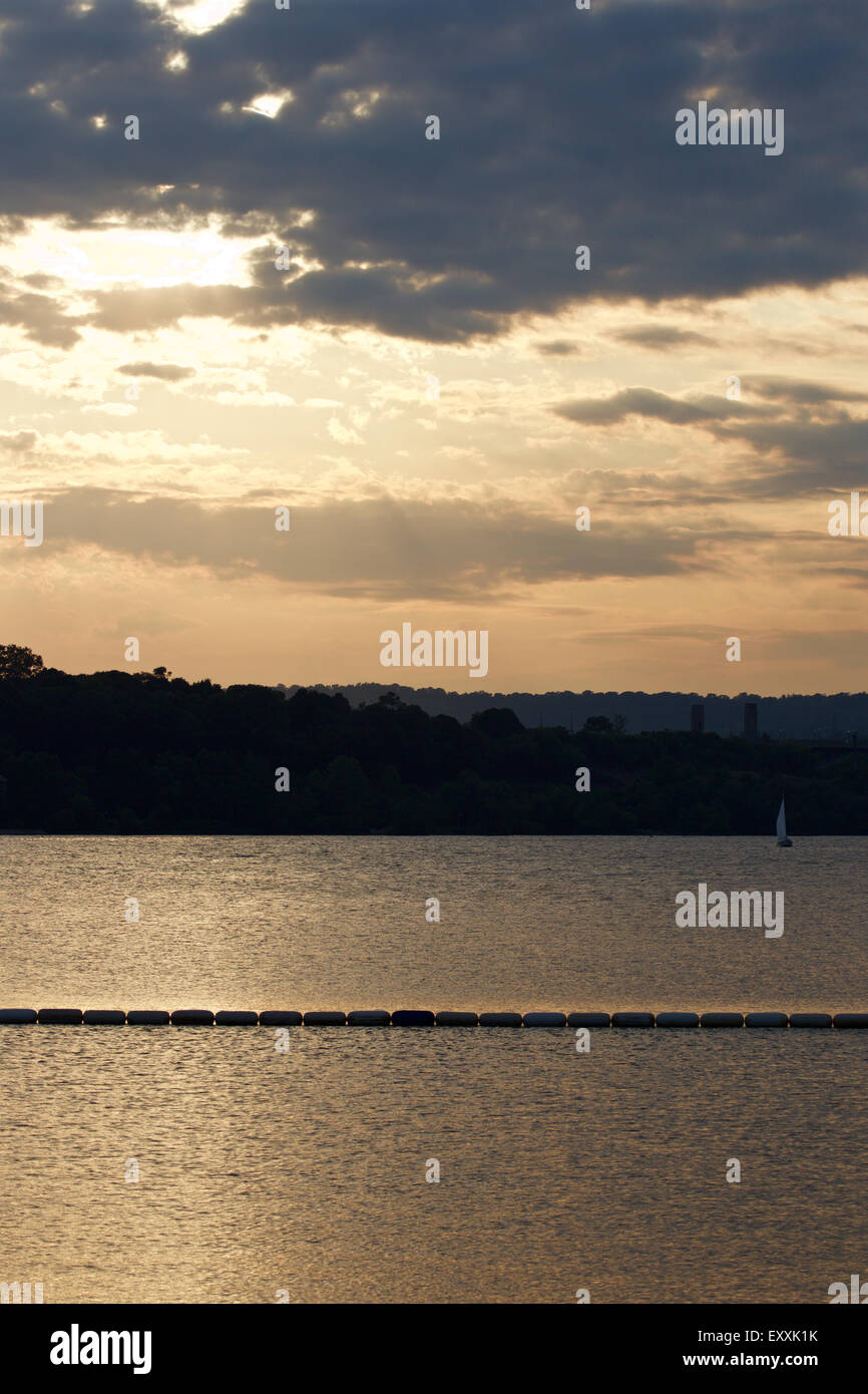 Beautiful sunset on the lake with the yacht Stock Photo - Alamy