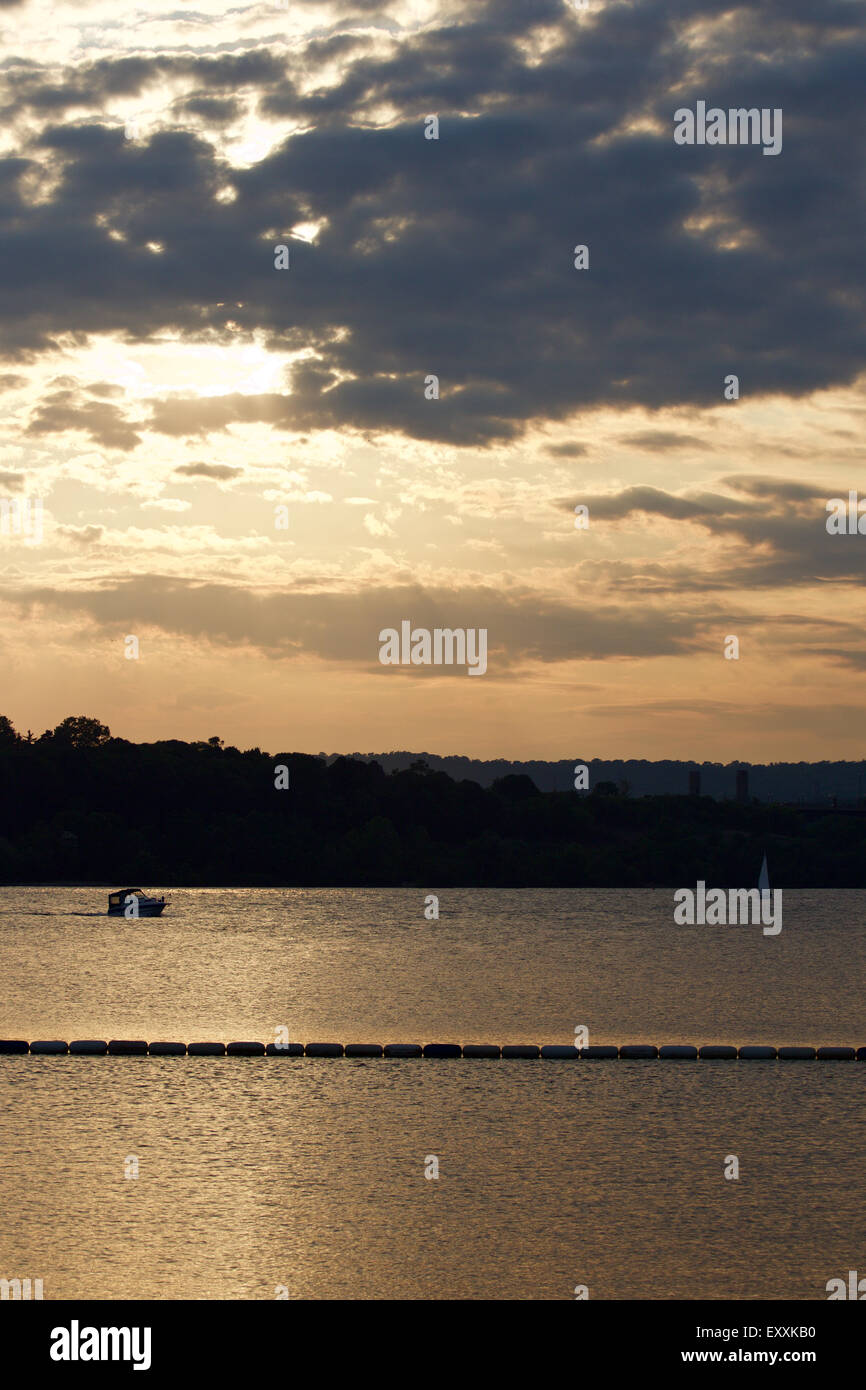 The beautiful sunset on the lake with two yachts Stock Photo - Alamy