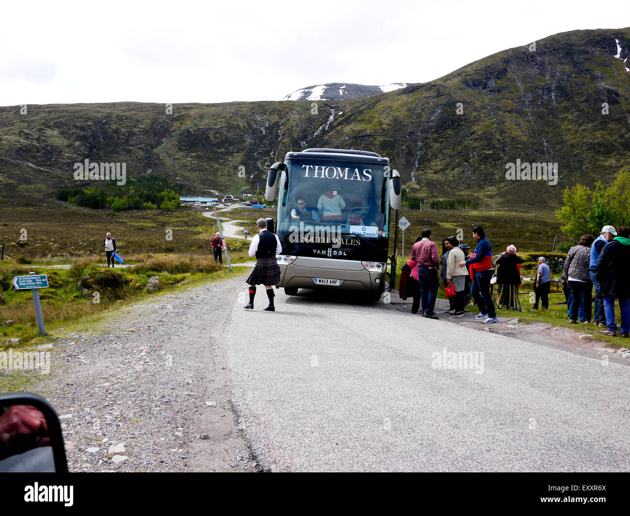 Tourists Coach on a single track road near the Glen Coe skiing centre, Argyle, Scotland, UK. Stock Photo