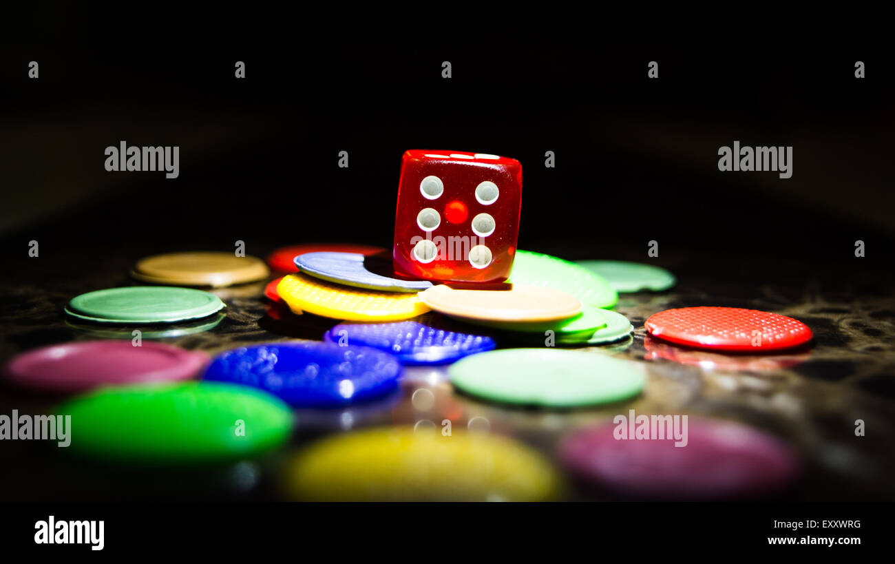 Casino dice and tokens used in many indoor games like ludo, snake and ladder Stock Photo Alamy